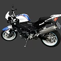Blue And White Sport Motorcycle With Black Seat Silver Exhaust And Modern Body Design