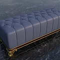 Blue Tufted Ottoman with Leather Upholstery and Gold Decorative Legs for Modern Living Space