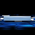 Modern Stage With Blue Lighting Arranged Seats Large Screen And Geometric Decorations