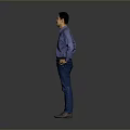 A Man Standing With Hands On Hips In Blue Shirt And Blue Jeans