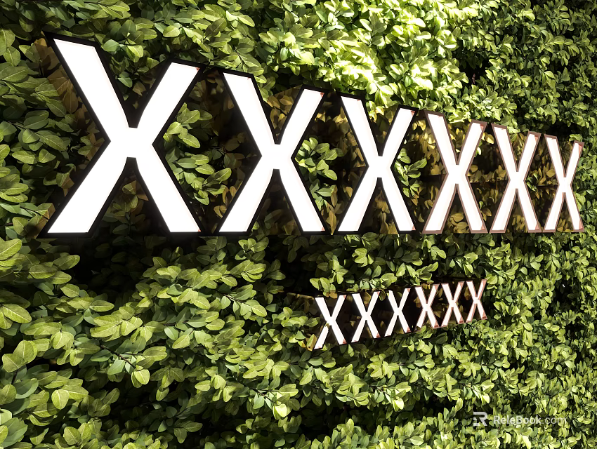Decorative Green Plant Wall Design With White Text Elements And Lush Foliage 3d model 