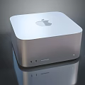 Apple Desktop Computer With Sleek Silver Design And Multiple Ports On Reflective Surface