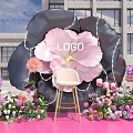 Giant Flower Shaped Photo Check In Spot With Pink Black Petals And White Chair