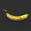 Ripe Yellow Banana With Brown Spots Isolated On Black Background