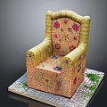 Ornate Yellow Chair With Colorful Floral Patterns On Stone Slab Platform And Green Grass Decorations