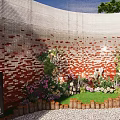 Garden Landscape With Red Brick Wall Green Plants Flowers Wooden Fence And Pebble Ground