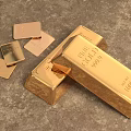 Precious Pure Gold Jewelry Featuring Shiny Gold Bars And Small Gold Pieces On Textured Surface