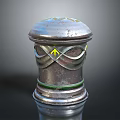 Shiny Metal Cylindrical Component With Decorative Top Yellow Arrows And Green Ring