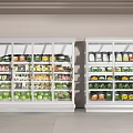 Two White Refrigerated Display Cases With Glass Doors Filled With Bottled Boxed Foods Vegetables Drinks