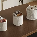 Fabric Storage Baskets with Decorative Details for Organizing Toilet Paper and Cloth on Wooden Tabletop