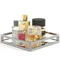 Elegant Perfume Cosmetics Displayed On Metal Tray With Glass Bottles And Gold Caps