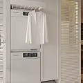 Clean Modern Entryway Interior With Hanging White Shirt Louvered Blinds And Whirlpool Washer Dryer