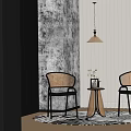Two Rattan Chairs With Black Frames And Small Side Table In Minimalist Room