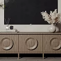 Modern Wooden TV Stand with Circular Details Dried Flowers and Diffuser on Light Wall