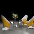 Stylish Table and Chair Set Featuring Yellow White Chairs Round Glass Table and Floral Centerpiece