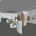 Modern Minimalist Clothing Store Interior With Clothing Racks Displayed Clothes And Decorative Mirrors