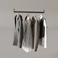 Metal Clothes Hanger With Hanging Sweaters Shirts And Jackets In Neutral Tones