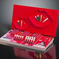 Open Red Cosmetic Gift Box With Lip Shaped Holders And Arranged Lipstick Tubes