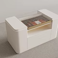 White Display Cabinet with Glass Top Interior Magazines and Drawer Storage on Carpeted Floor