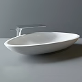 White Oval Countertop Wash Basin With Modern Silver Faucet And Sleek Design