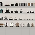 Stylish Tea Sets Display on White Shelves with Teapots Teacups and Decorative Items