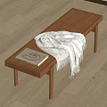 Wooden Striped Bench With White Blanket And Patterned Book On Light Floor