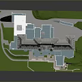 Historic Classical Building Complex With Courtyard Multiple Roofs And Green Lawn