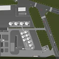 Industrial Plant with Multiple White Storage Tanks Green Lawns Roads and Vehicles