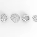 Playground Equipment With Silver Metal Spiral Structures In Various Shapes