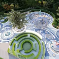 Interactive Children's Play Area With Circular Maze Elephant Figures And Green Spaces