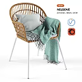 Stylish Rattan Armchair in White with Gray Pillow and Green Blanket
