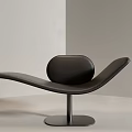 Modern Black Leather Lounge Chair With Sleek Curved Design And Metal Base For Minimalist Room