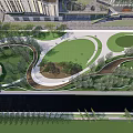 Park Landscape with Open Green Lawns Curved Pathways and Lush Trees