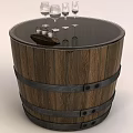 Wooden Barrel Shaped Coffee Table With Black Top Metal Bands And Wine Glasses