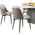 Round Marble Top Dining Table Set With Gray Chairs And Decorative Elements