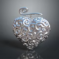 Artistic Silver Heart Shaped Sculpture With Intricate Swirl Carving And Top Curl Design