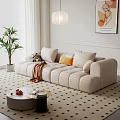 Beige Sectional Sofa With Pillows Throw Blanket Coffee Table And Green Plant In Living Room
