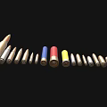 Collection of Various Size Colorful Bullets as Weapon Ammunition on Black Background
