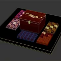 Square Chocolate Pieces Arranged Around Red Wooden Box With White Text On Dark Tray