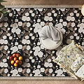 Square Area Rug with White Floral Design on Dark Background and Fruit Bowl Round Stool