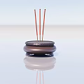 Decorative Ornament Set With Brown Incense Burner And Red Incense Sticks On Smooth Surface