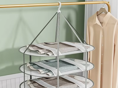 Three Tiered Metal Clothes Hanger Holding Folded Clothes with Shirt Hanging Nearby in Indoor Space 3d model