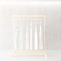 Gold Modern Clothes Rack With Hanging Dresses On Gray Textured Wall Background