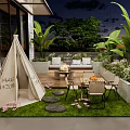 Garden Courtyard with Teepee Tent Outdoor Furniture Green Plants Grass Lawn and Stone Stepping Stones