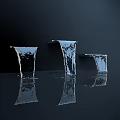 Garden Ornaments With Black Square Structures And Water Streams Falling Into Water Creating Ripples