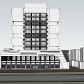Modern Multi Storey Office Building With Large Glass Windows And Ground Floor Entrance