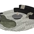 Green And Black Sofa With Round Coffee Table On Geometric Pattern Rug