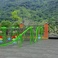 Outdoor Playground Equipment With Green Frame Black Climbing Net And Colorful Columns For Kids