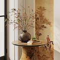 Decorative Vase With Dried Branches And Small Flowers On Round Wooden Table With Traditional Mural