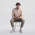 Man Using Mobile Phone To View Reptile Content While Sitting On White Stool 3d model